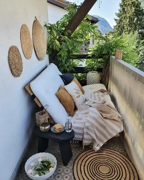 A Wooden Low Lying Couch with a Stubby Black Stool