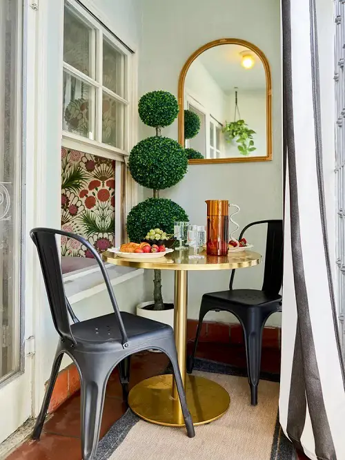 Black Chairs and a Golden Table