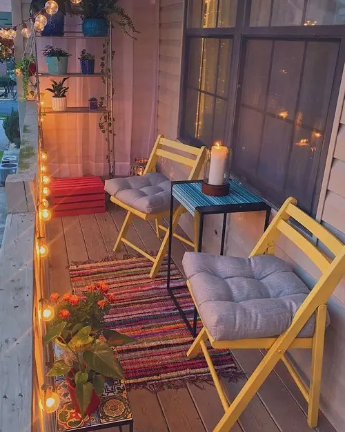 Two Folding Wooden Chairs on a Balcony