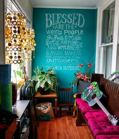 Balcony Decorating Ideas Chalkwood Wall, Wind Chimes, and Colorful Upholstery