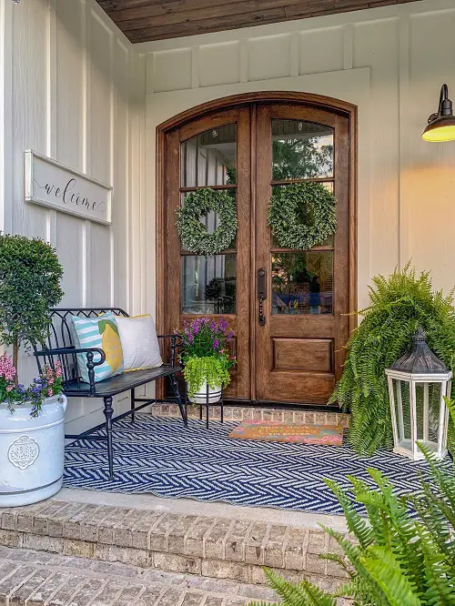 Plants with Large Wooden Door and a Lantern