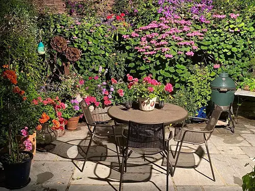  Small Patio Surrounded by Flower Garden 