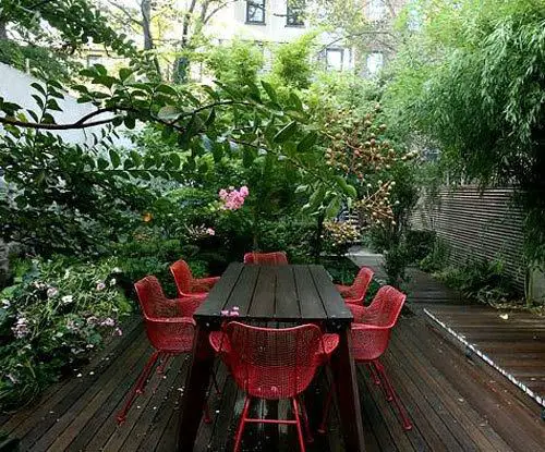 Outdoor Garden With Red Chairs