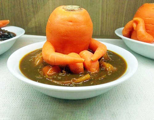 Carrot that Looks like it is Having a Bath in Tub