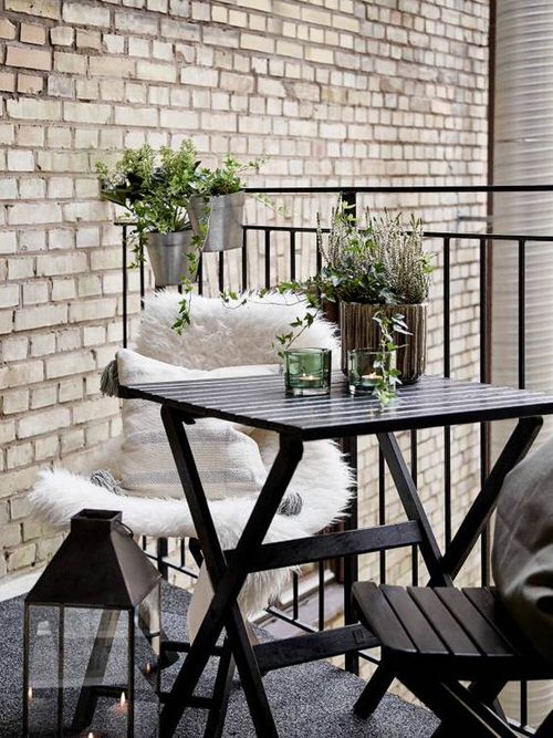 Table for Two with Hanging Planters on Railing