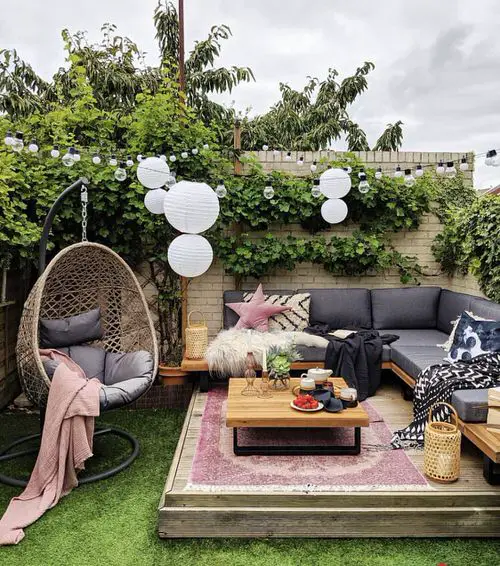 Modern Patio with Hanging Lights and Chair