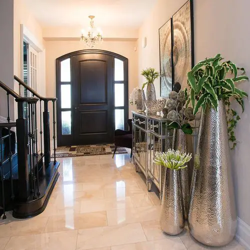 Plants in Tall Silver Planters at the Entrance