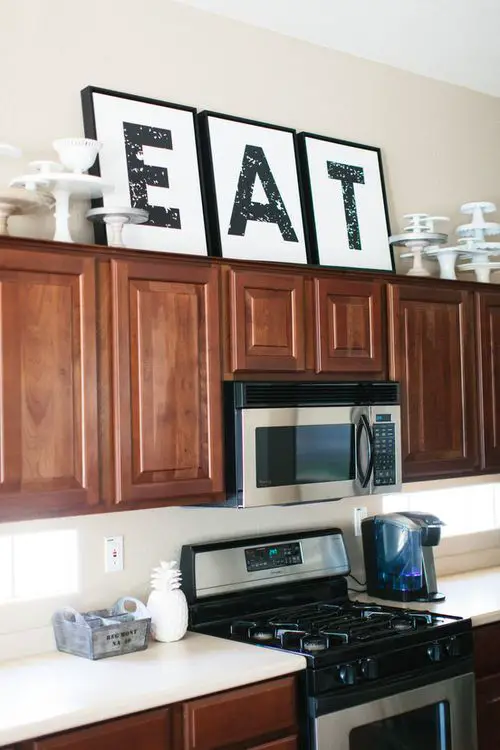 Genius Ways to Use Showcase Some Art Space Above Your Kitchen Cabinets