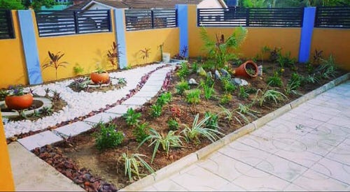 Front Yard Landscape with a Blend of Plants and Natural Stones