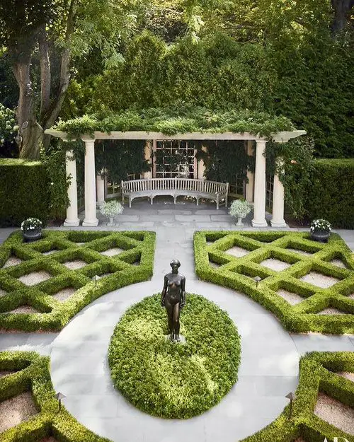 Contemporary Garden with a Statue in the Center