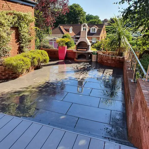 Minimalistic Patio with Large Pavers and Vertical Wall Garden