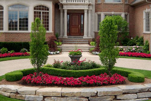 Front Yard Landscaping with Pink Blooms and Lush Topiary