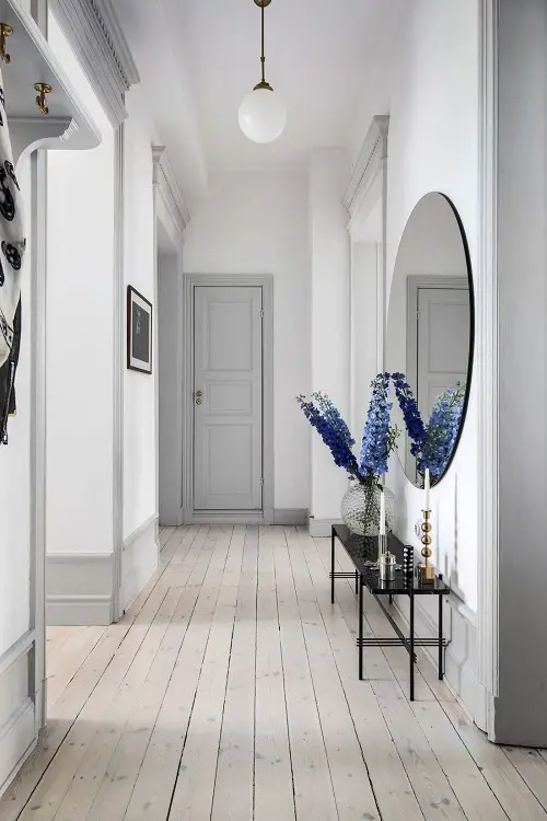 Wisterias by a Round Mirror in the Hallway