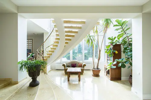 Houseplants and an Aesthetic Urn Planters by the Staircase