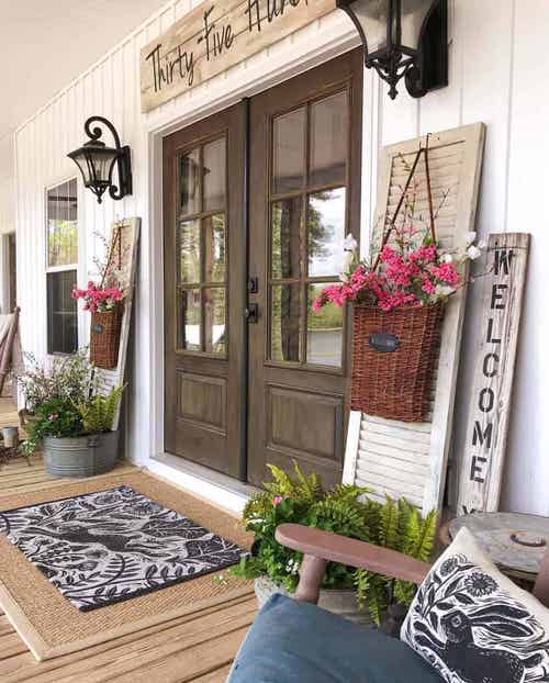 Vintage Porch with Flower Baskets and Fern Pots