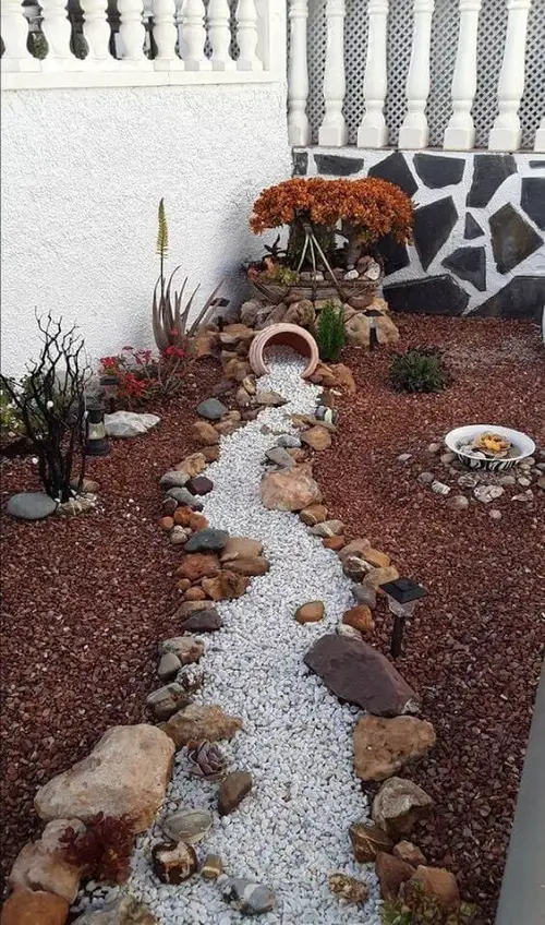 Front-Yard Spilled Pot Feature with Red Stone Landscaping