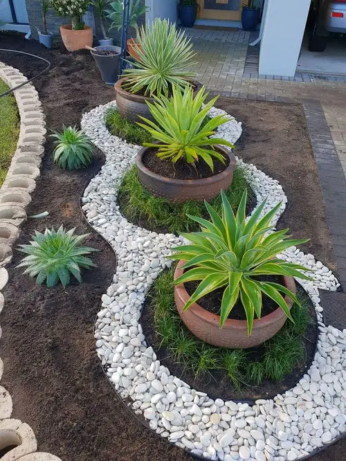 White Pebble Mulching around Patio Pots