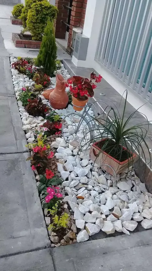 White Gravel Landscaping with Colorful Foliage and Blooms