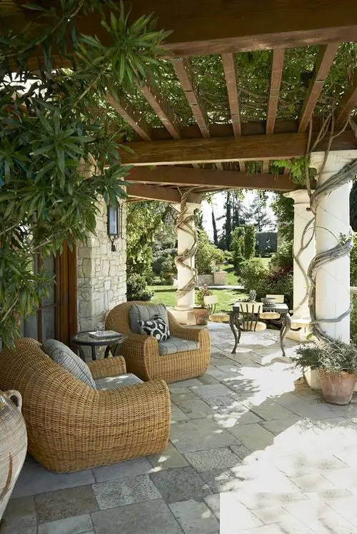 Bulky Rattan Couches Shaded by Vining Pergola