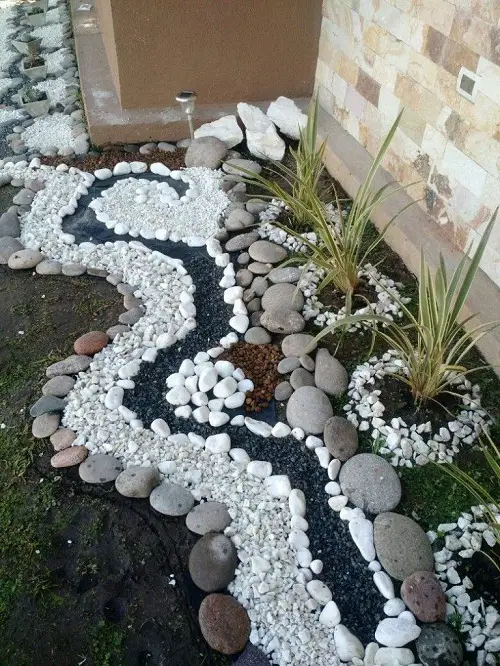 Coastal Landscaping with River Rocks and Chalk Paving