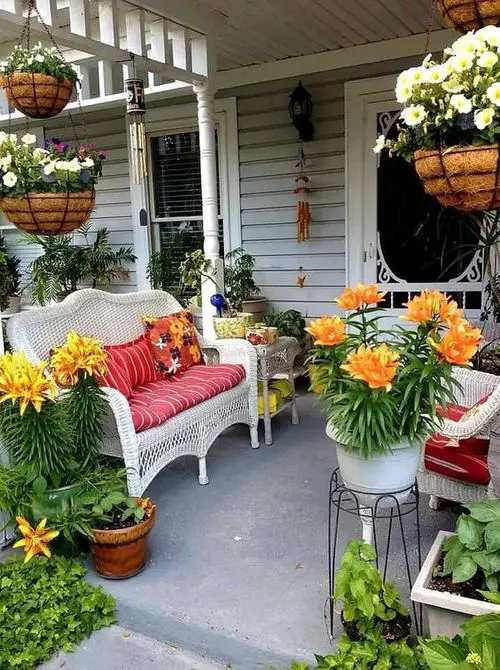 Colorful Patio Design with Orange Lilies and Hanging Coir Baskets