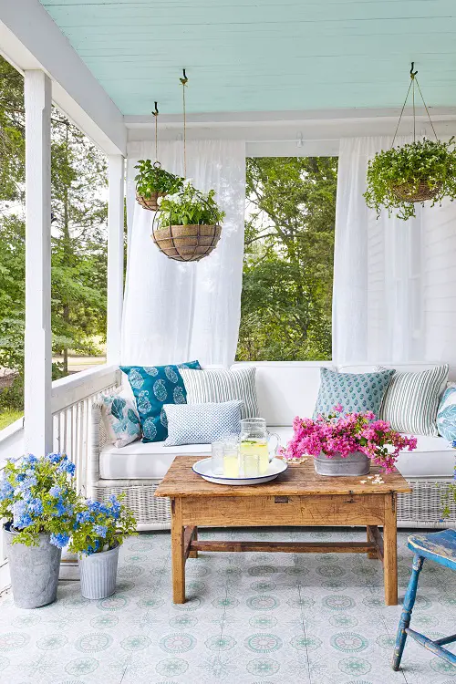A Serene Porch with Hanging Plants to Sip and Unwind!