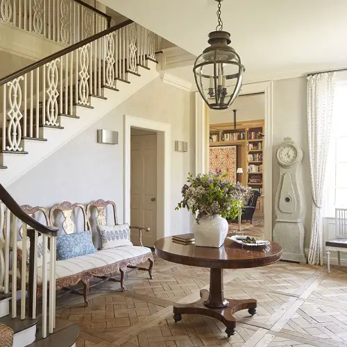 Antique Oak Flooring with a Round Center Table in the Foyer