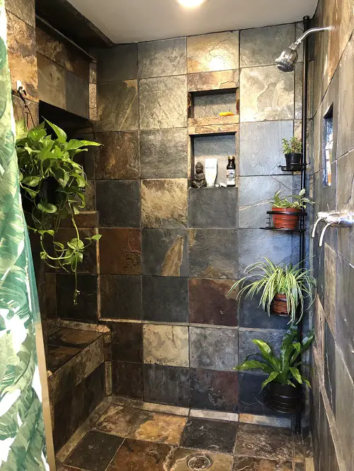 Small Pots and Dark Tiles jungle bathroom ideas