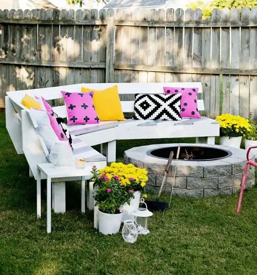 White Wooden Benches in a Semi Circular Fashion