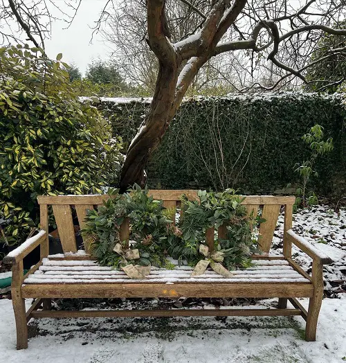 Long Wooden Bench with Christmas Wreaths