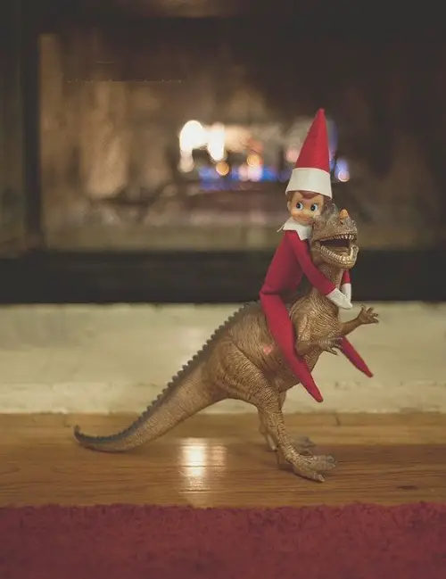 Elf on the Shelf Riding a Dinosaur