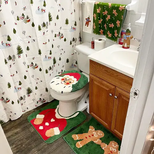 Christmas Seat Covers, Mats, Towels, and Gingerbread Figurine in bathroom