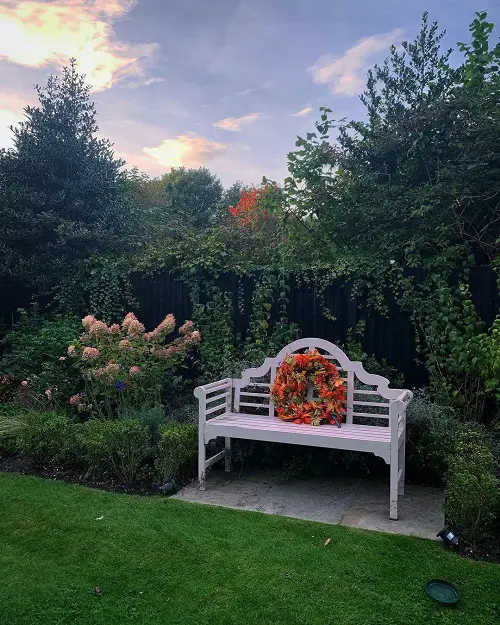 White Bench with Colorful Wreath