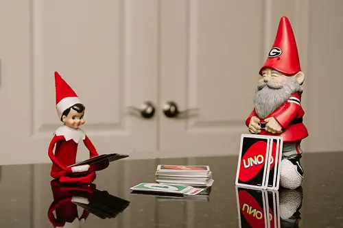 Elf on the Shelf Playing Uno with Gnome