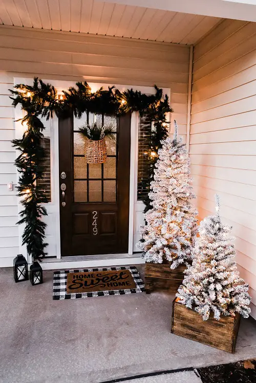Two White Christmas Trees in porch