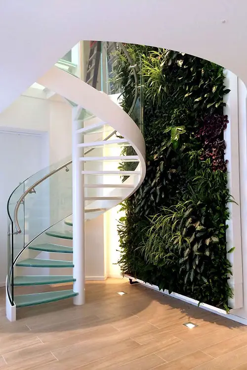 Garden on the Staircase Living Wall Full of Long-Leafed Plants