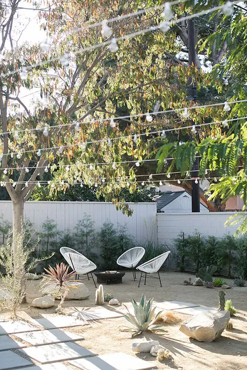 Chairs, String Lights, and Large Boulders