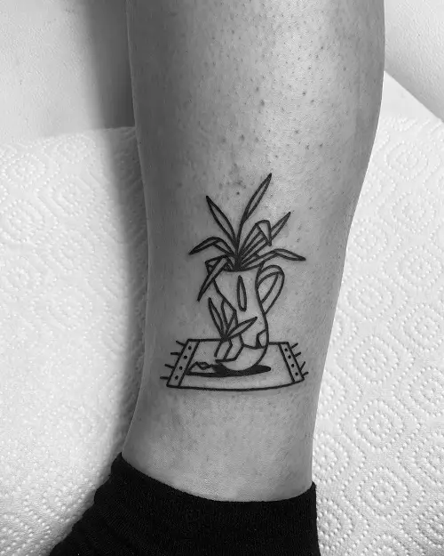 Plant stem Tattoo on legs ideas