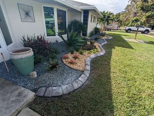 Curb with Concrete and Pebbles Edge