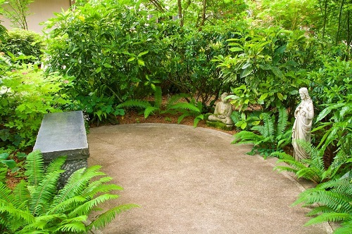 . Zen Garden with Figurines and a Bench