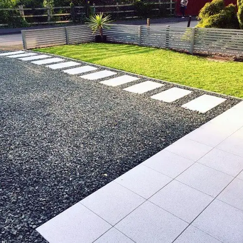 Gravel Driveway with Path and Metal Fence