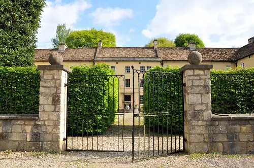 Black Metal Gate and Gravel Driveway