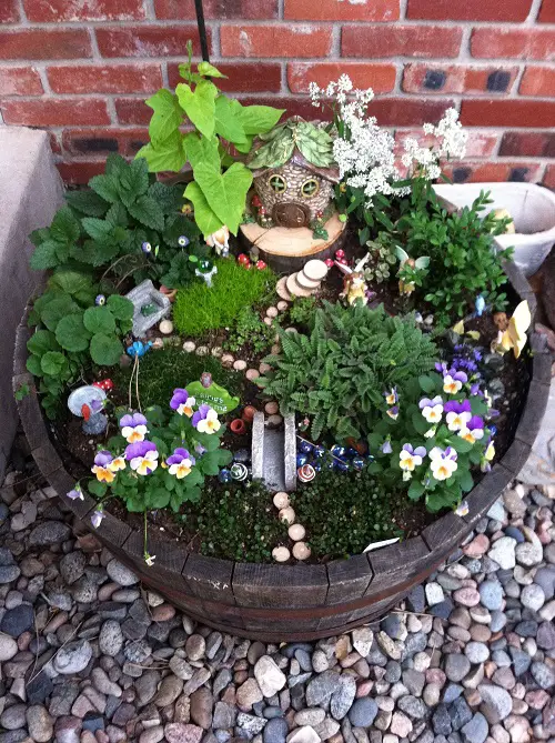 Fantastic Whiskey Barrel failry garden Planters Ideas