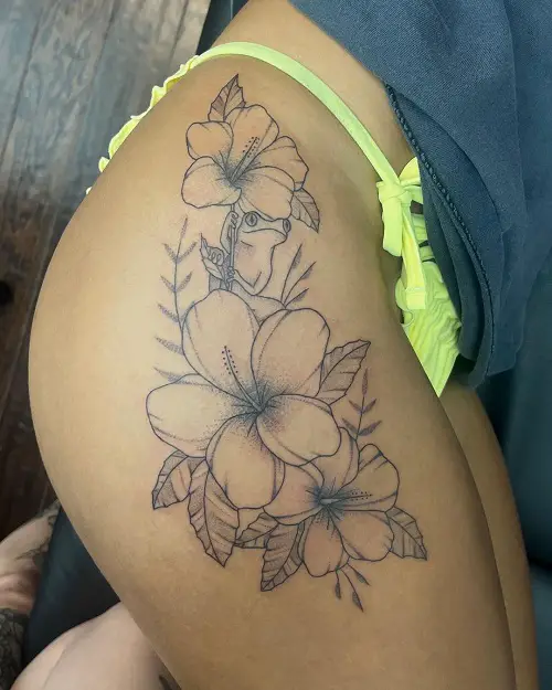 Hibiscus Thigh Tattoo with a Tiny Frog