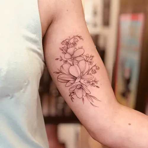 Magnolia and Lily of the Valley Tattoo