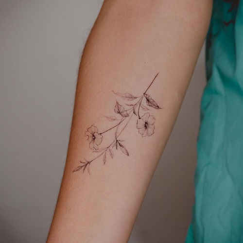 Delicate Petunia Stem on Forearm tattoo