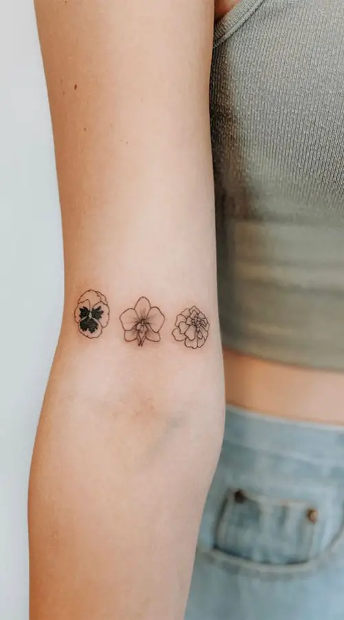 Pansy, Orchid, Magnolia Blooms tattoo