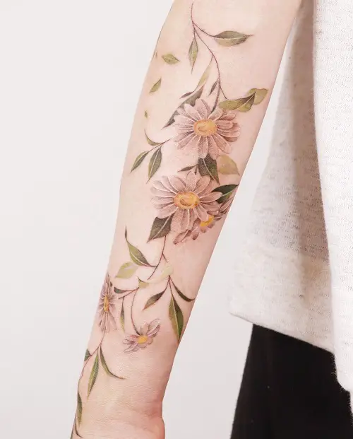 Artistic Daisy Sleeve birth month tattoo