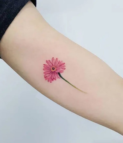 Innocence in a Daisy birth flower tattoo