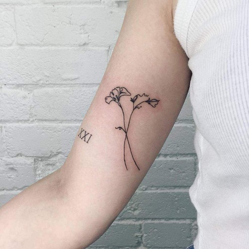 Minimal Sweet Pea Bicep Ink tattoo